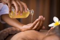 a woman getting a back massage at a spa